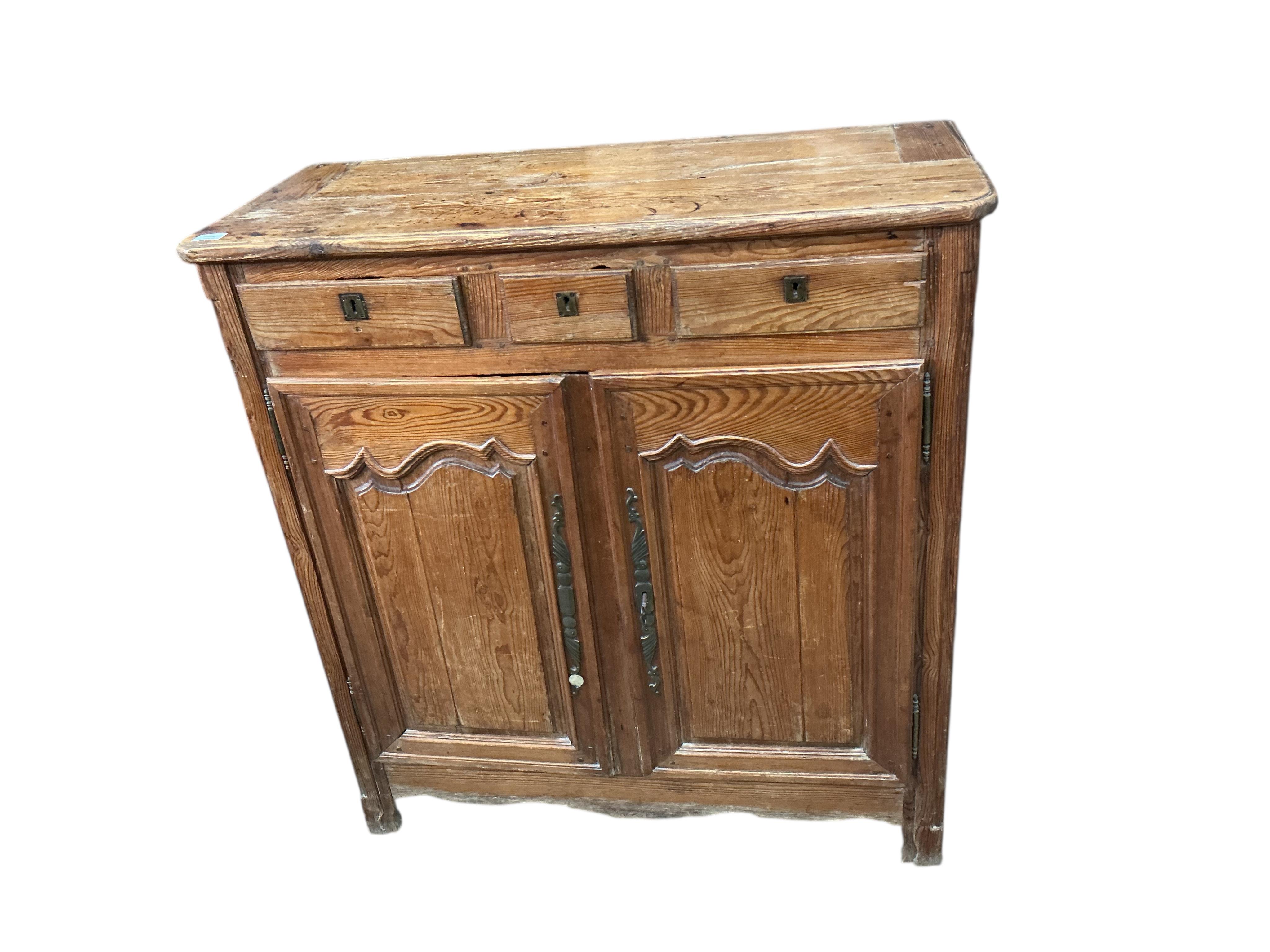 An early 19th century French pitch pine side cabinet, width 109cm, depth 48cm, height 115cm
